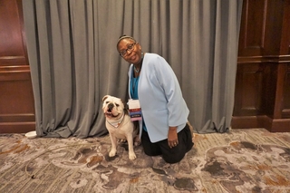 Dr. Dorceta Taylor posing for a photo with Handsome Dan the Yale Bulldog